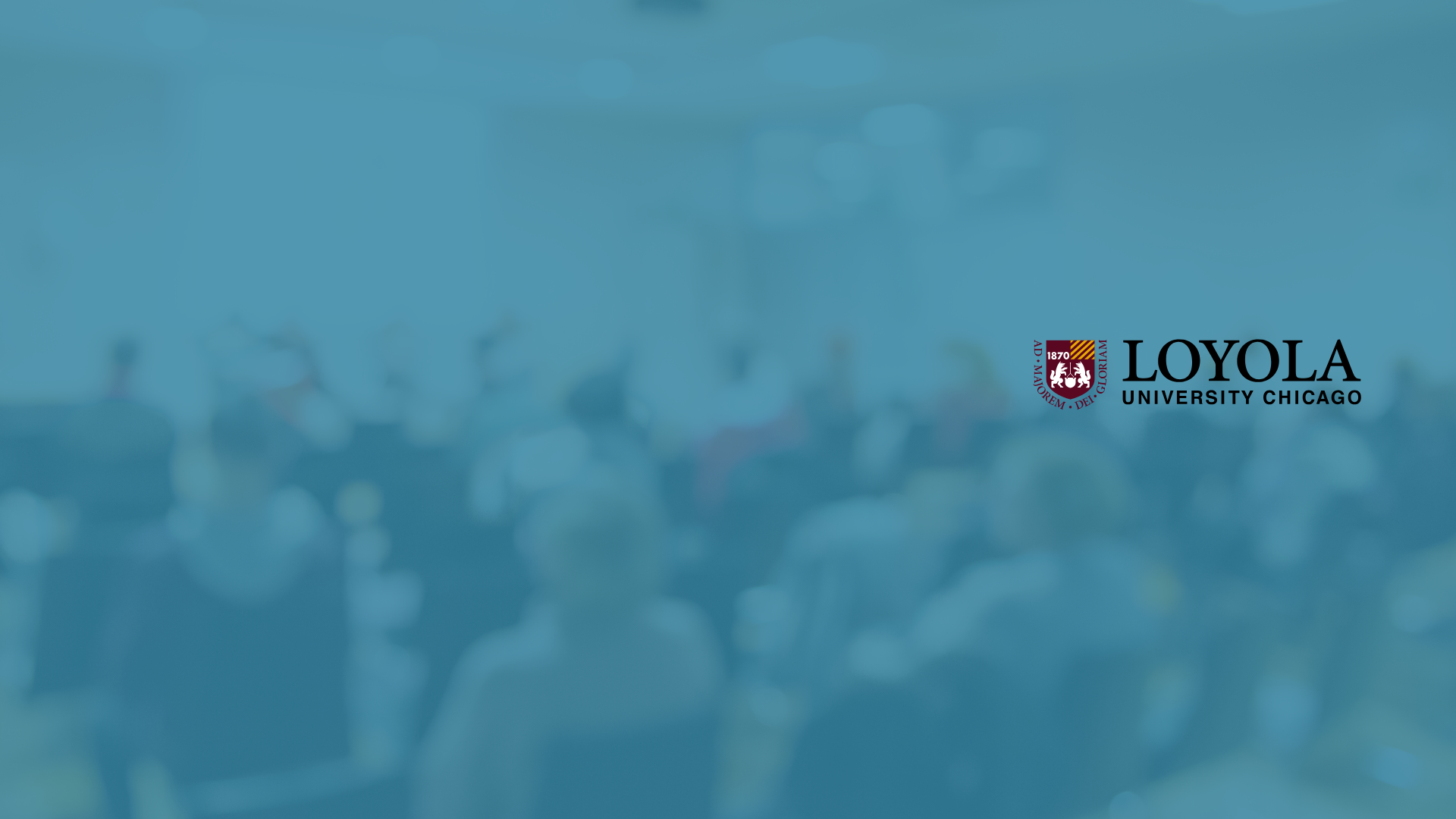 Loyola logo on blurred image of conference audience
