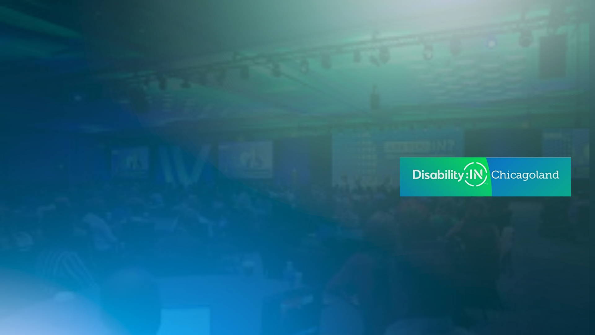 Blue and green logo of Disability:IN Chicagoland on a blurred conference or event background.