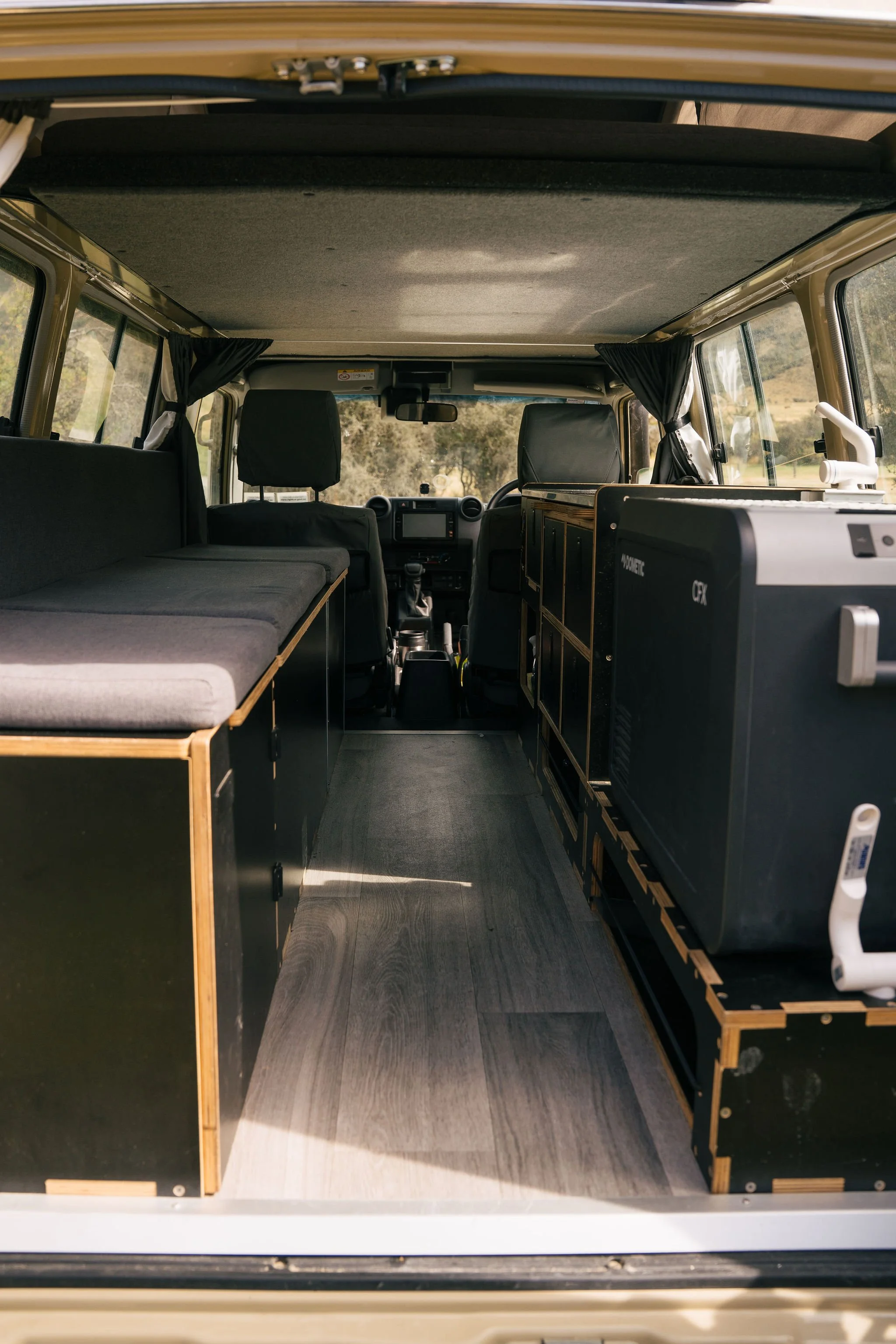 Land Cruiser Troopy interior fit-out with bed platform and storage – Trekker Adventures