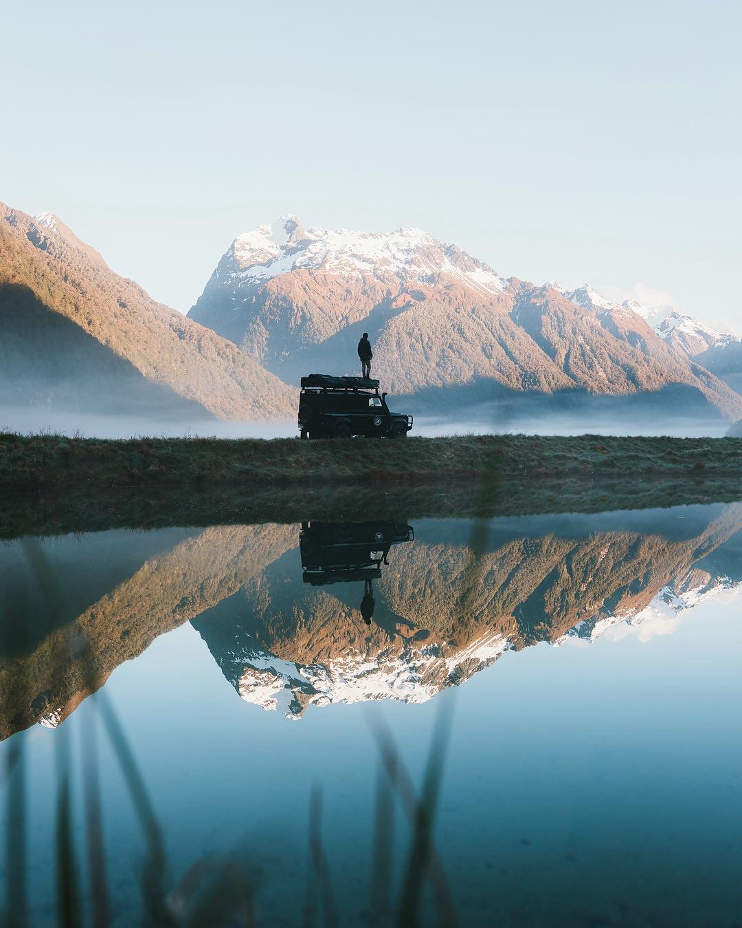 4WD beside alpine lake on New Zealand road trip