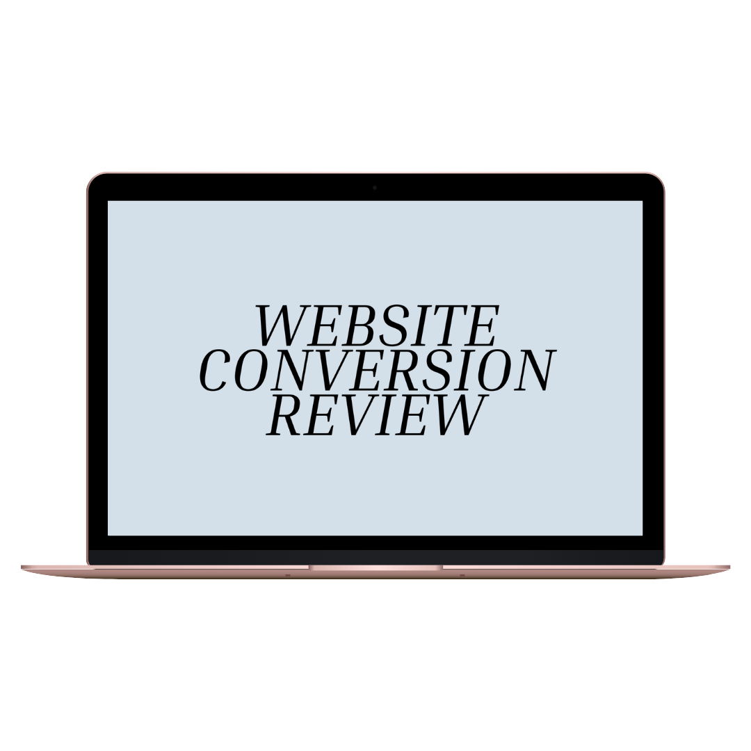 Laptop displaying the text 'Website Conversion Review' on its screen.