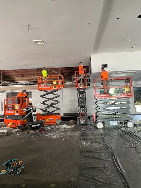 Team Of 4 Construction Repairs with Scissor Lifts Repairing Ceiling | AJ Building & Restoration Team
