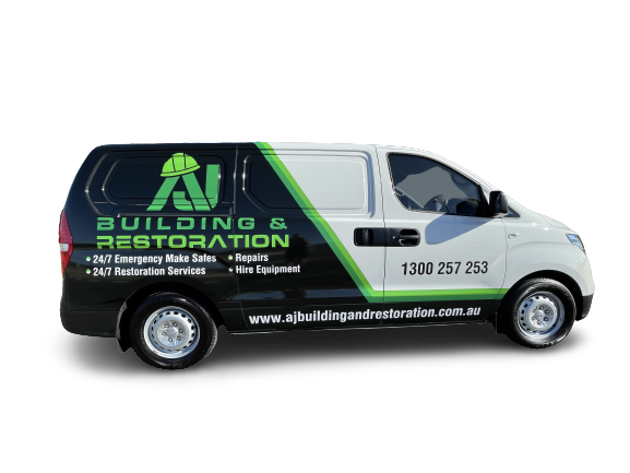 Commercial building and restoration van with company logo, contact information, and services listed.