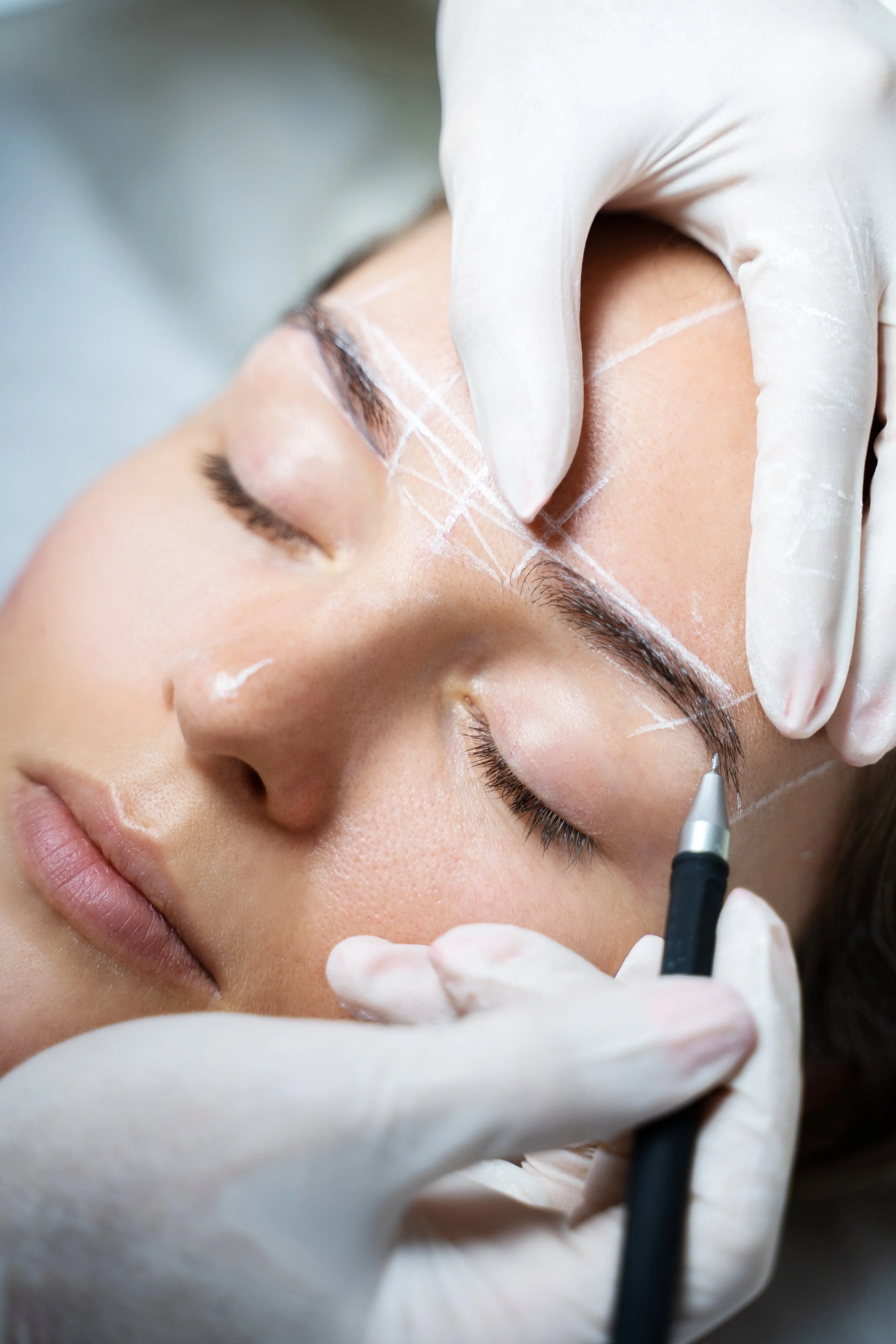 Close-up of a woman receiving a cosmetic injection or treatment on her face, with a medical professional wearing gloves performing the procedure.