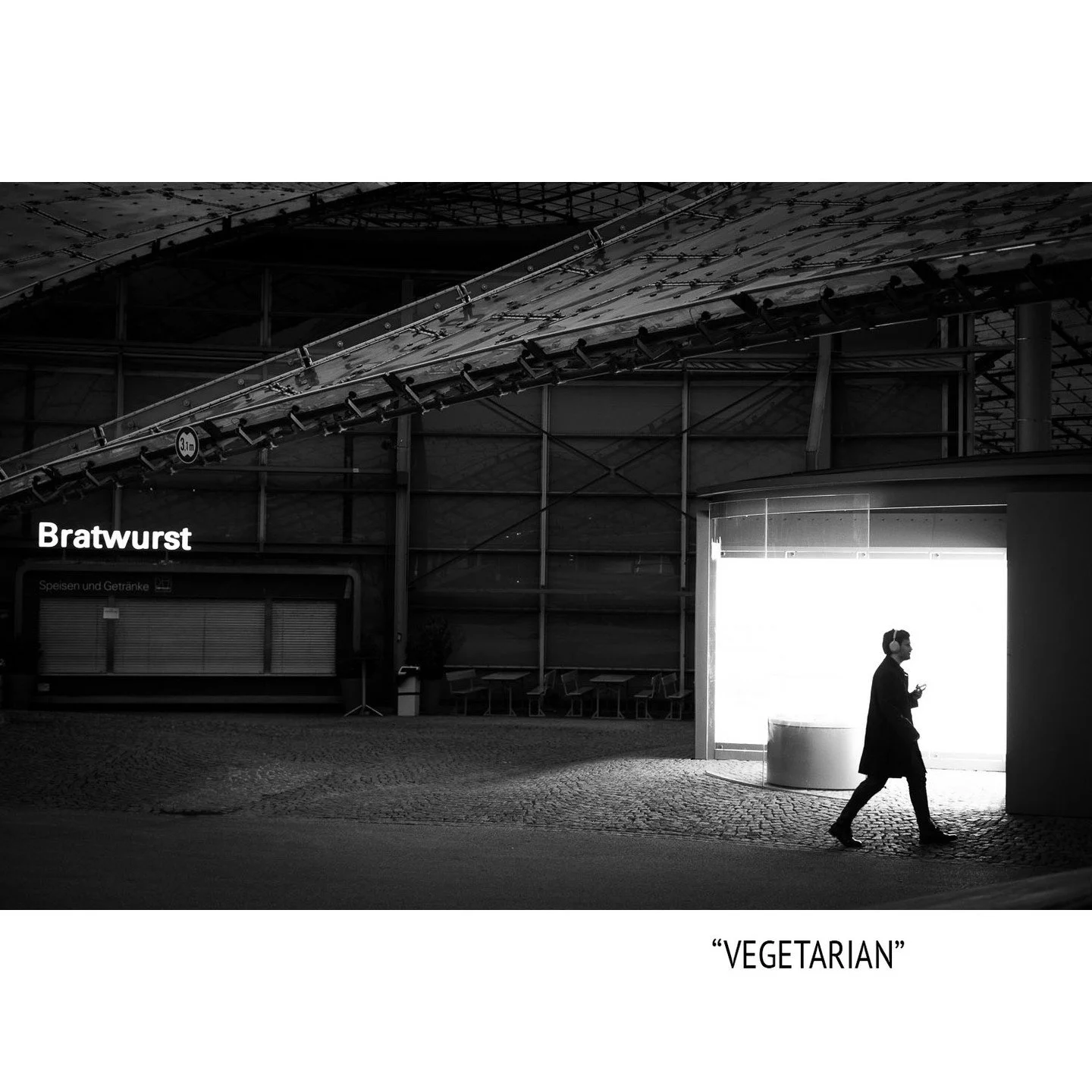 Would it still be "street-photography" if I remove the word "Bratwurst" in photoshop? Or is this word an important part of the picture that balances the bright area on the right? What do you think? #bnw #blackandwhitephotography #