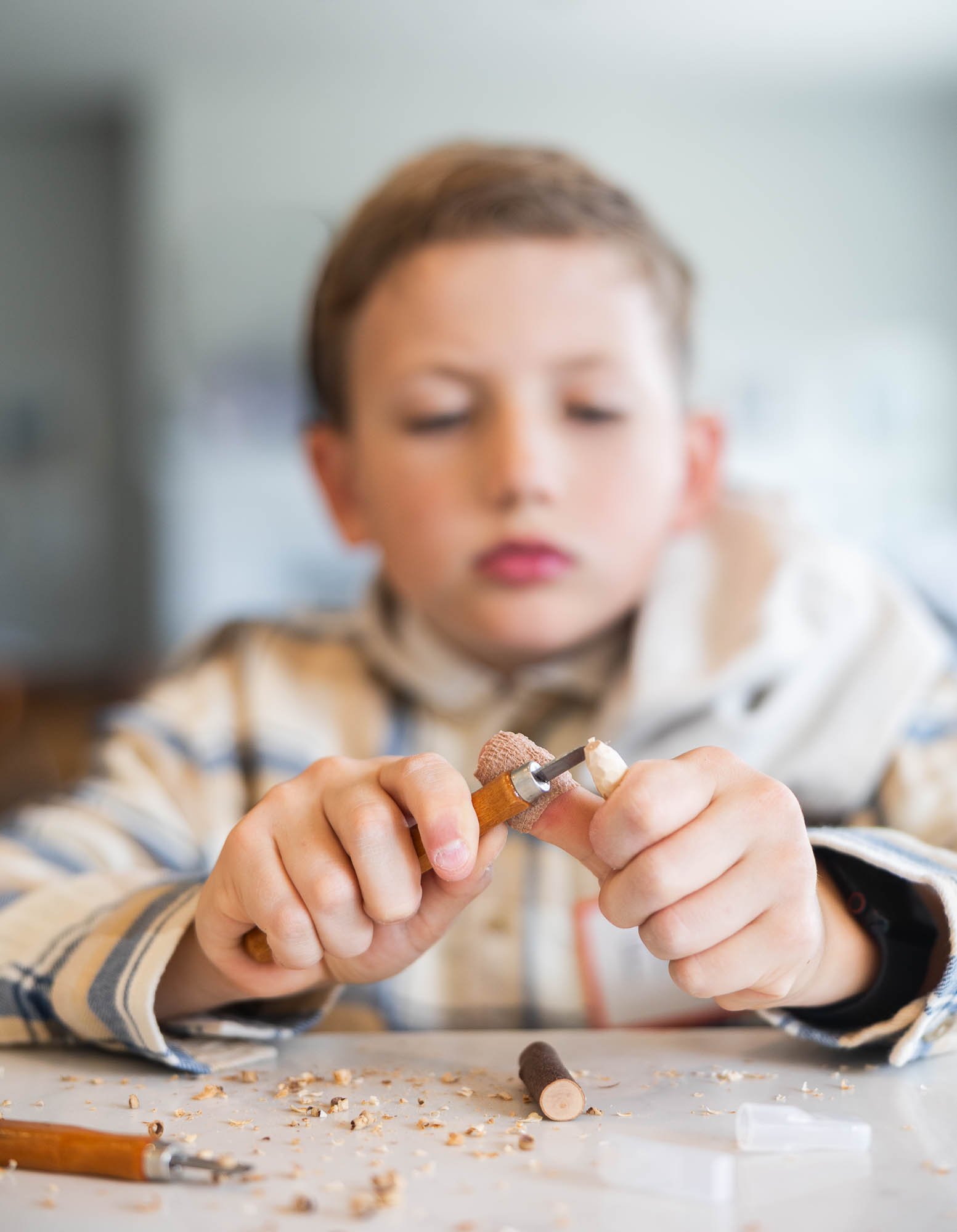 Boy in Utah wood carving class