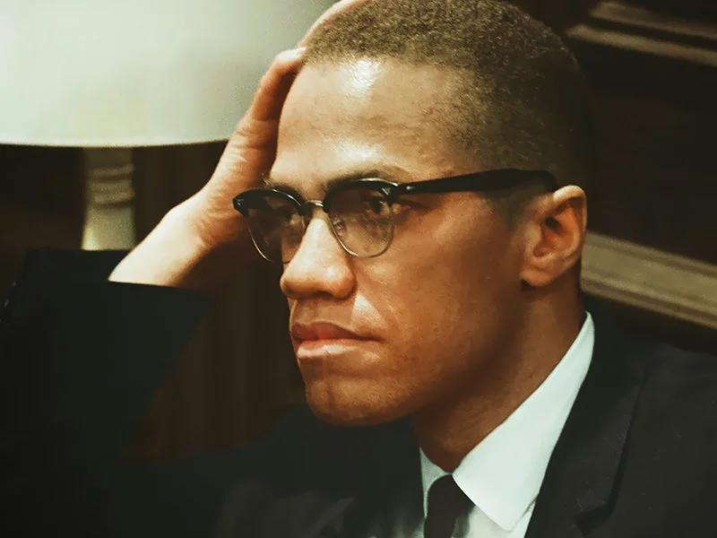 Malcolm-X-sitting.jpg