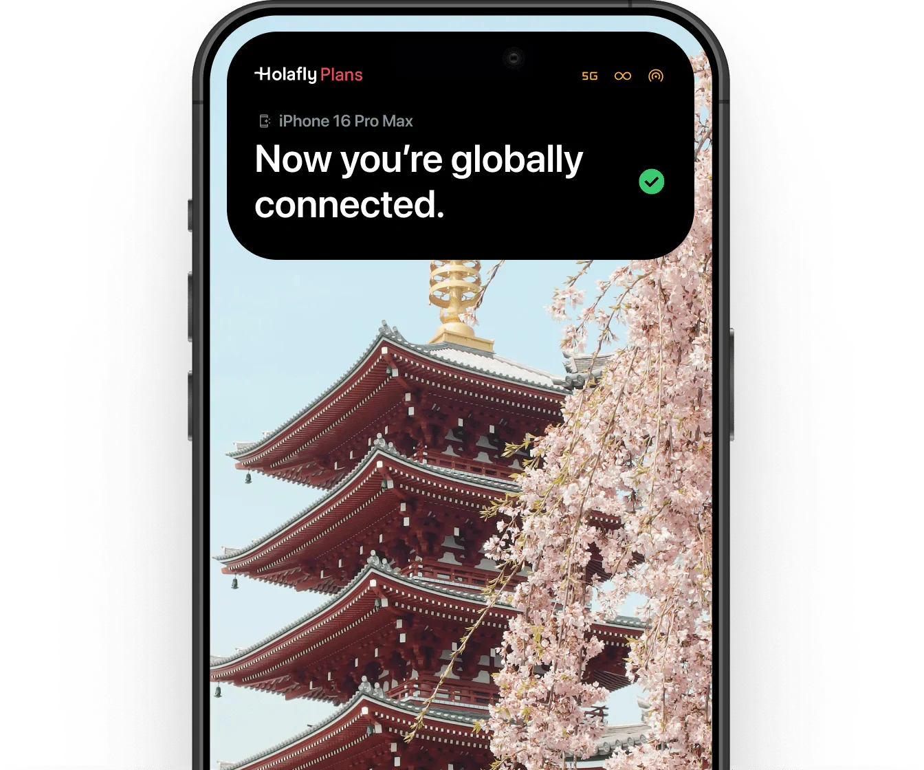 Pantalla de un teléfono que muestra un mensaje de conexión global y un fondo con un templo tradicional japonés y cerezos en flor.
