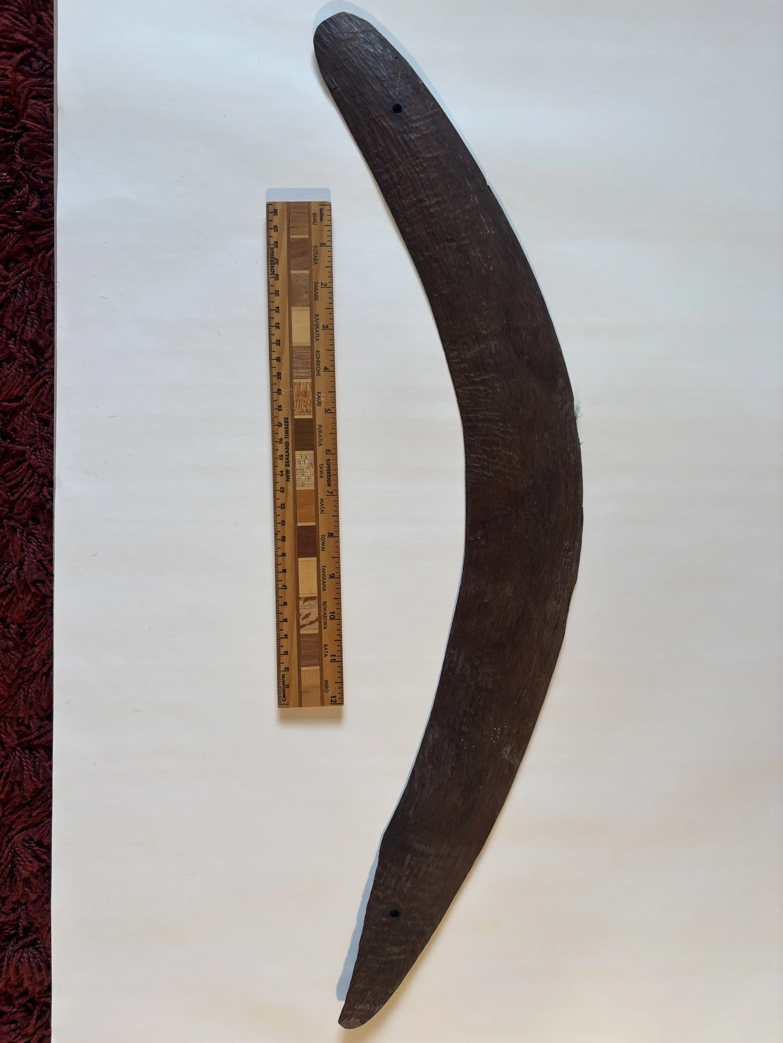 An historic hand carved Aboriginal “Throwing Stick” of a heavy heartwood; chipped at one end. A collectors piece.