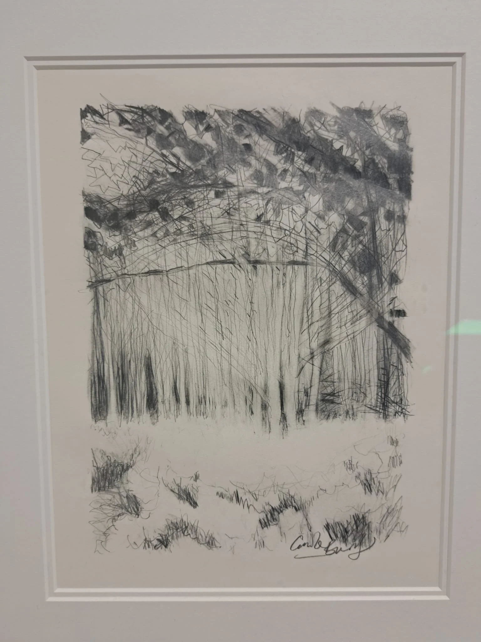 A black and white abstract sketch of a landscape. The upper part shows a dense, dark, textured sky, the middle features vertical and diagonal lines resembling a structure or trees, and the bottom has scribbled, rough lines. The artist's signature is