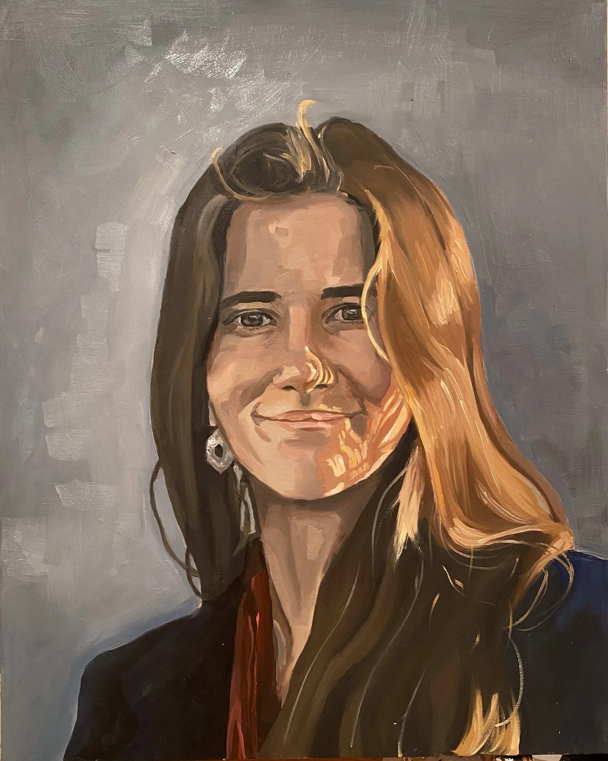 Oil painting portrait of a smiling woman with long, wavy brown hair, wearing earrings, and a dark top, against a gray background.