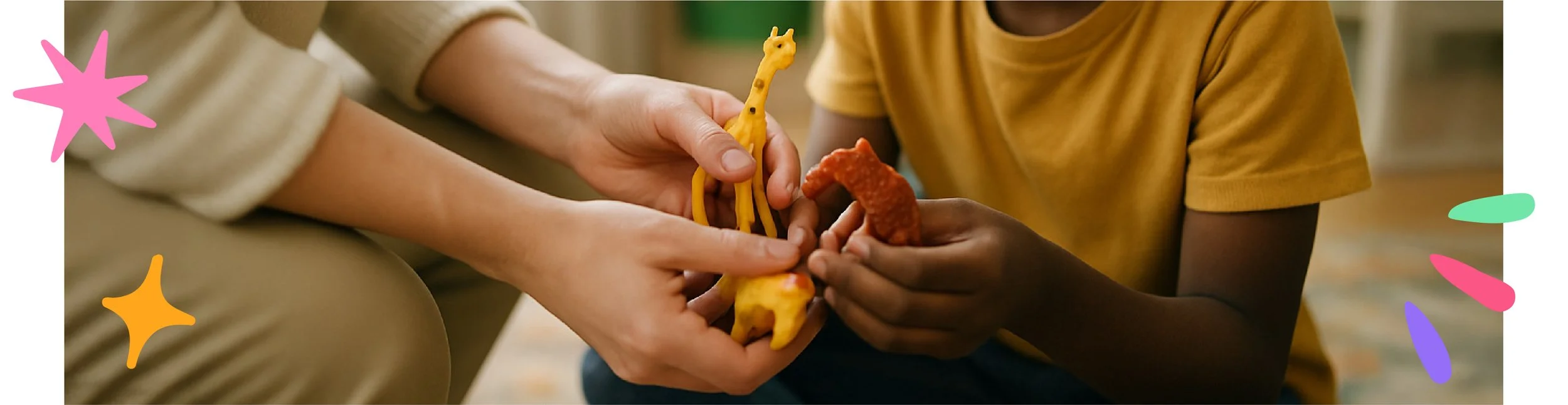 close up of play therapist and child's hands holding toys together