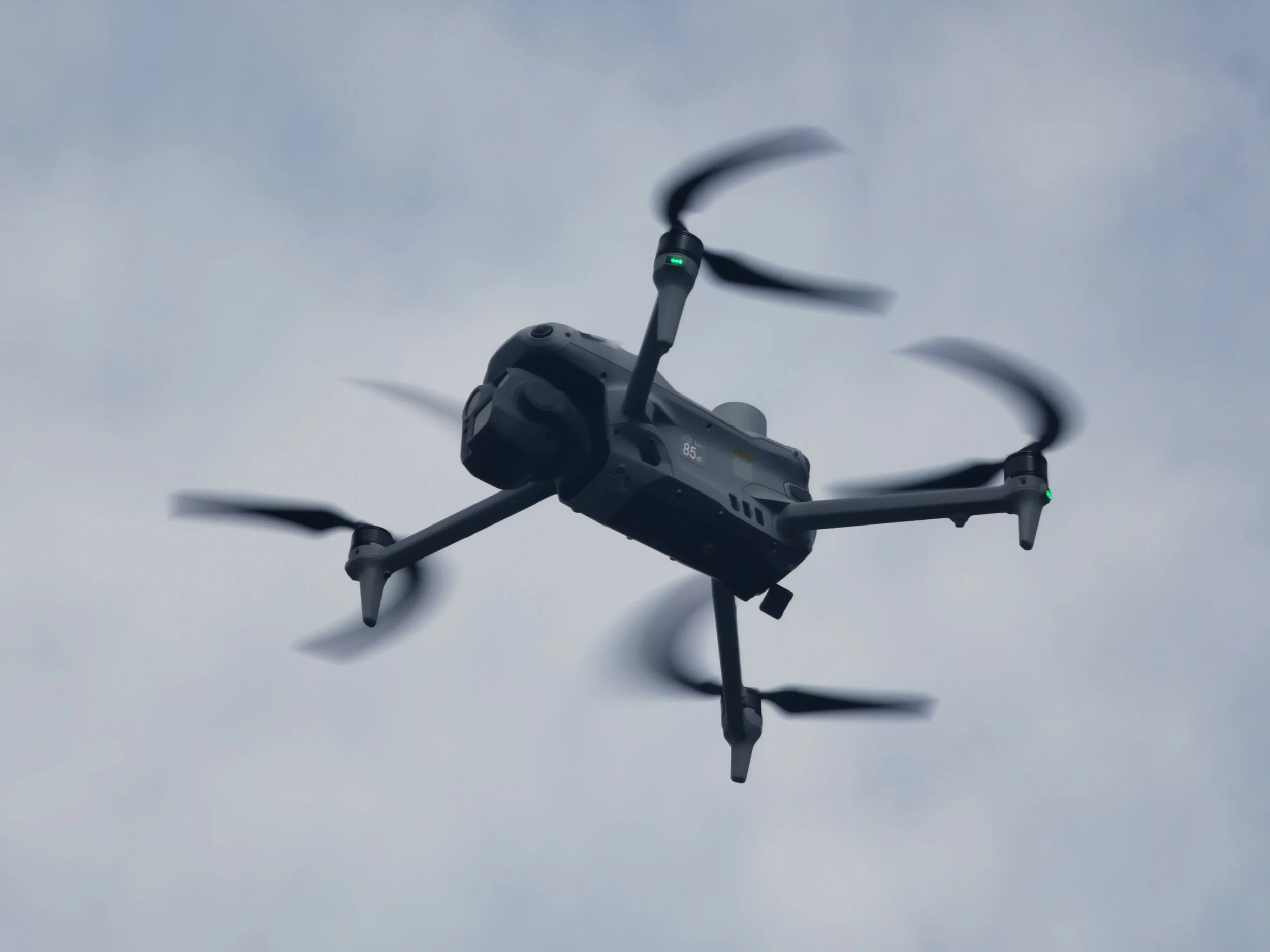 A drone flying in the sky with a cloudy background. conservation services South West England, ecological restoration UK, wetland creation and river restoration, habitat restoration and biodiversity