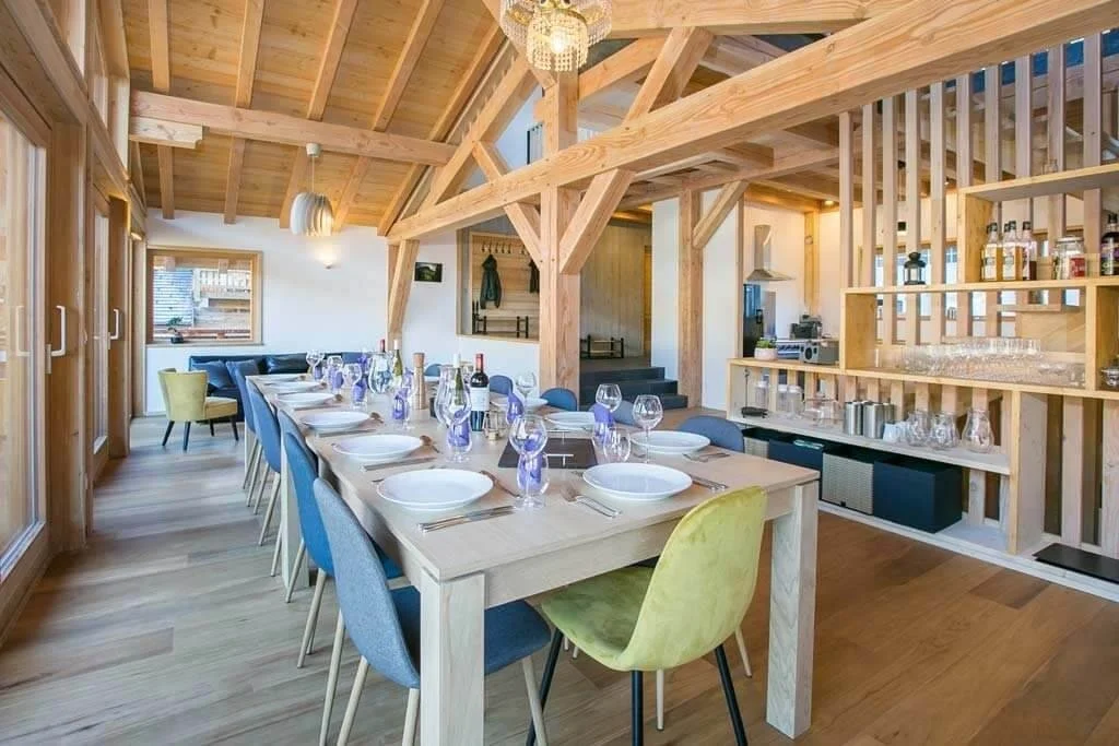 Chalet dining table with a table set ready for service.