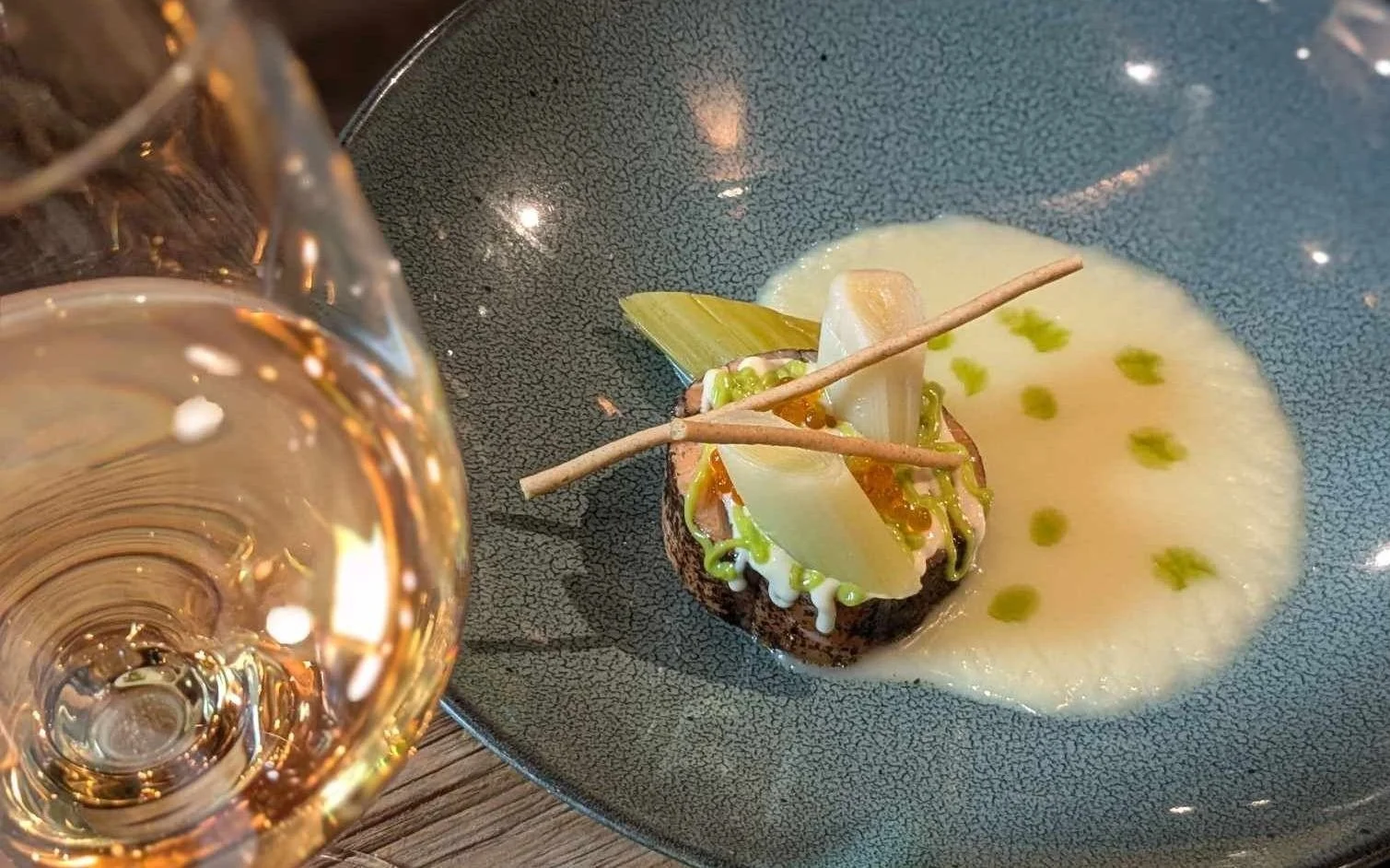 Indulgent meal with a glass of white wine.