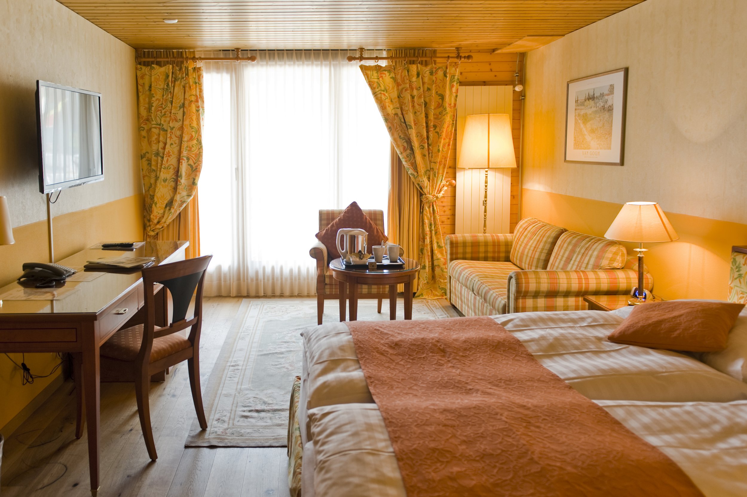 Classic double room with plenty of natural light. A large double with sofa suite in the corner.