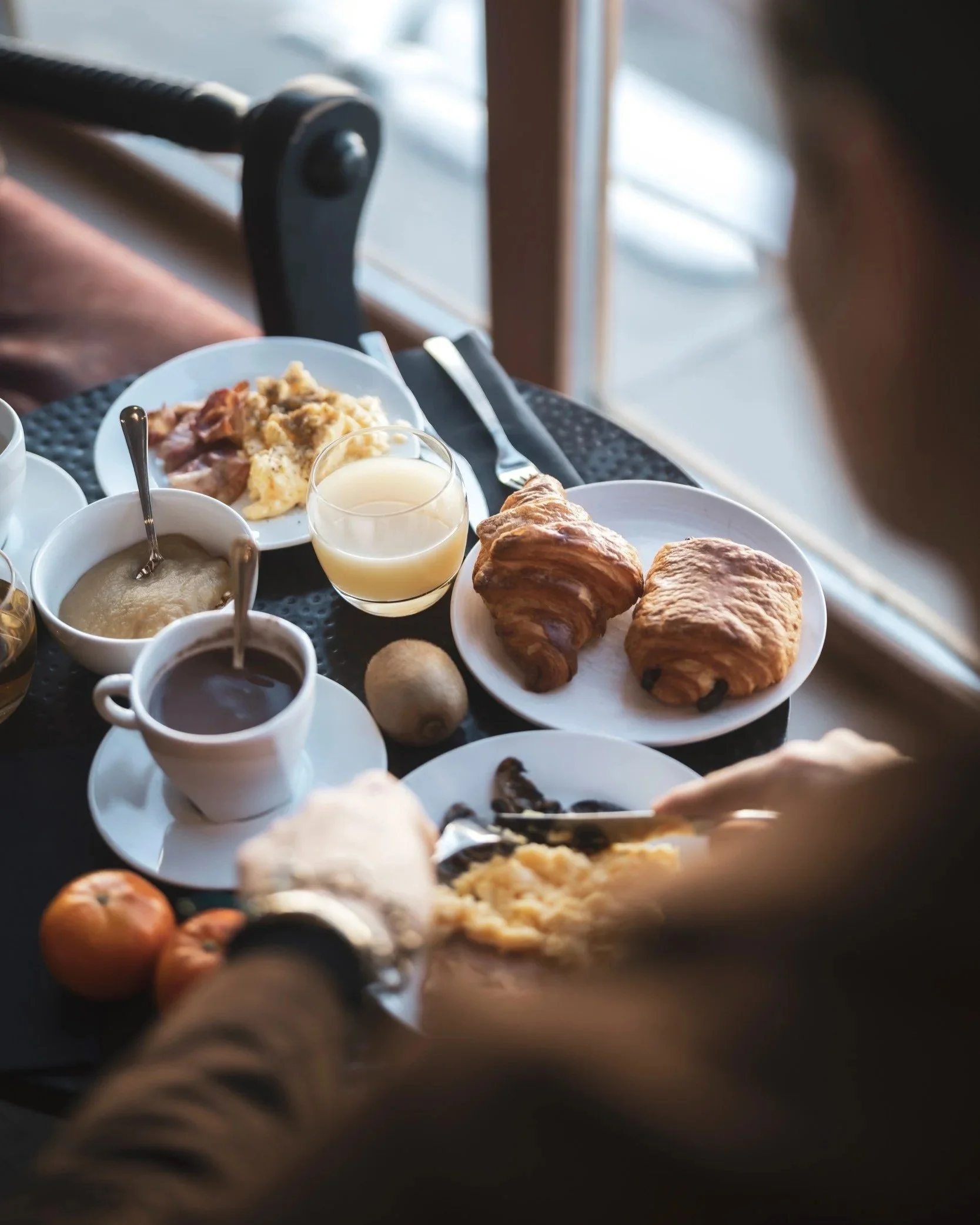 Generous buffet breakfast at a window seat.