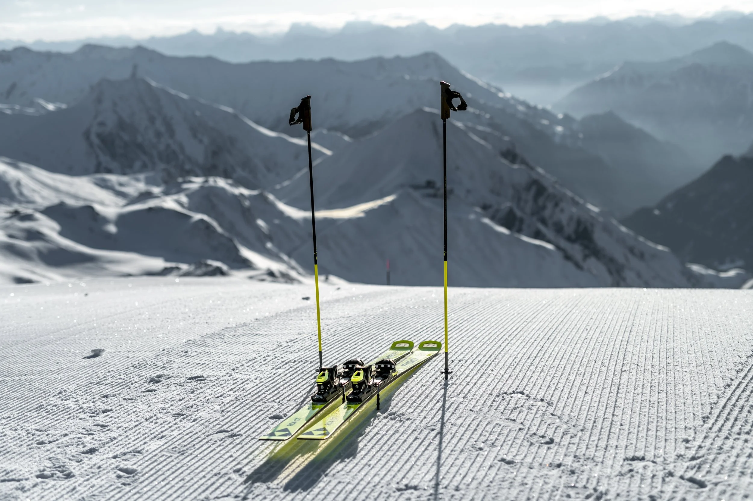 Pristine conditions with green skis ready to take you down the mountain.