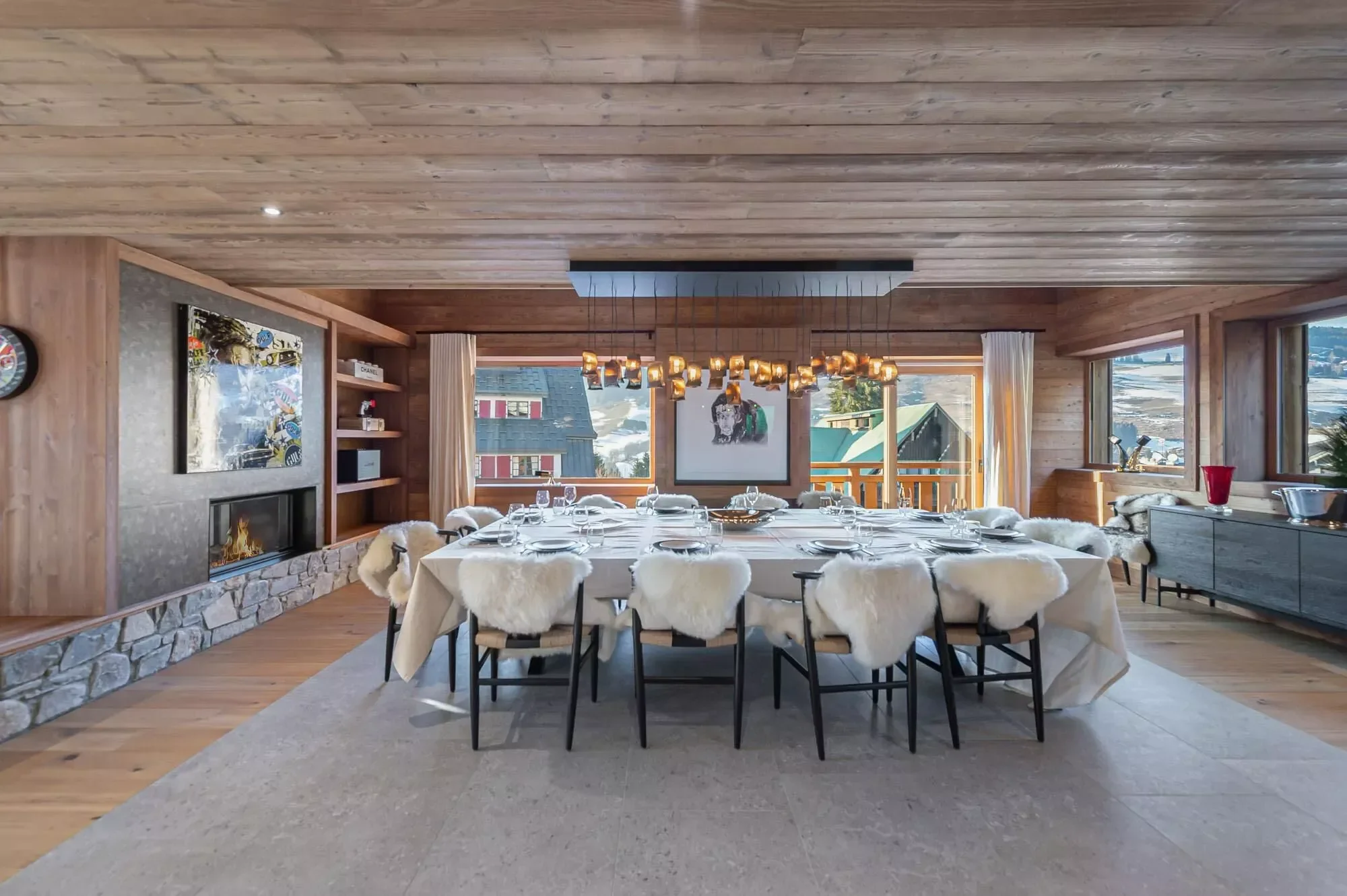 Modern dining area with a striking contrast of colours. Plenty of natural light and woods around.