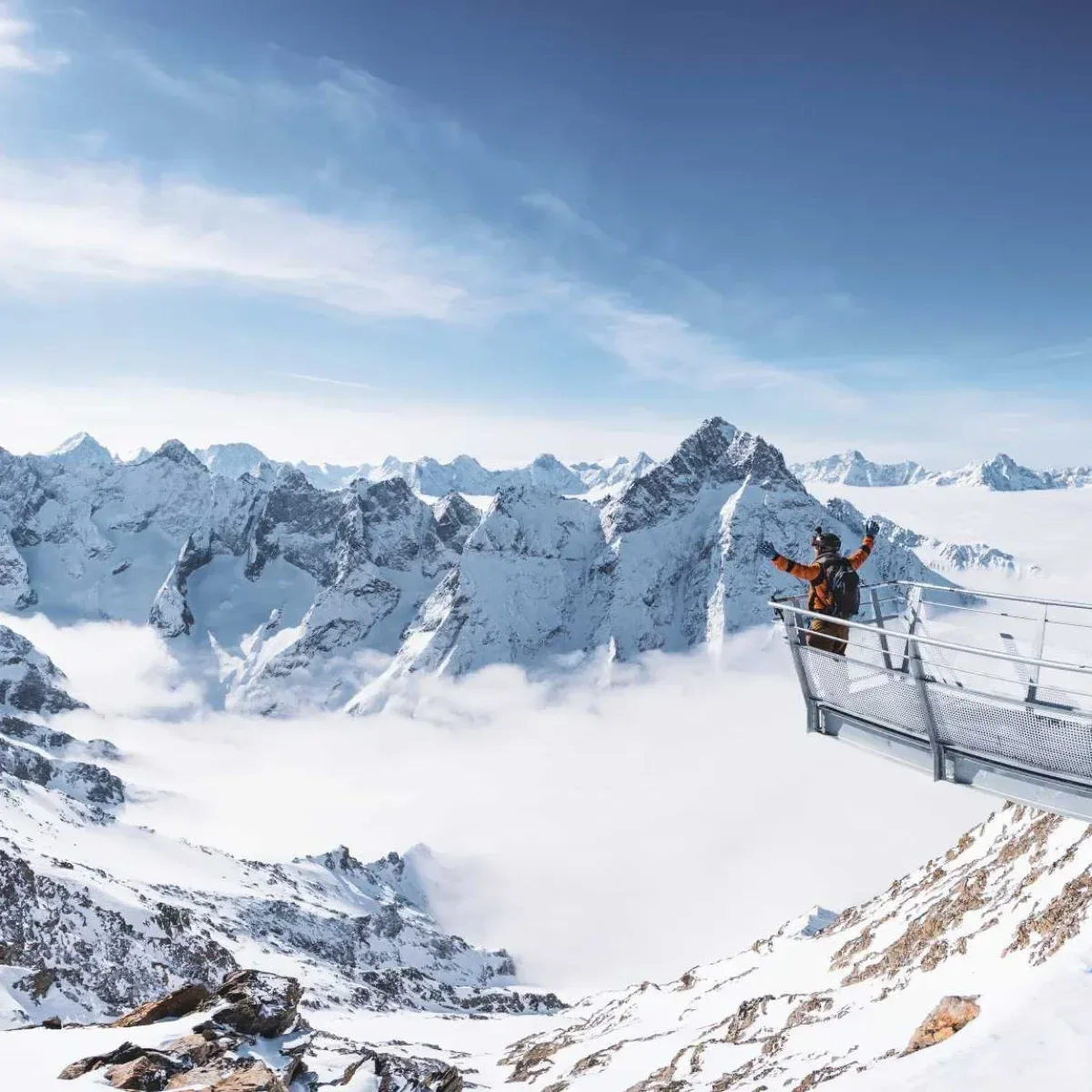 Mountaineer standing on the edge of the viewing platform in Les Deux Alpes