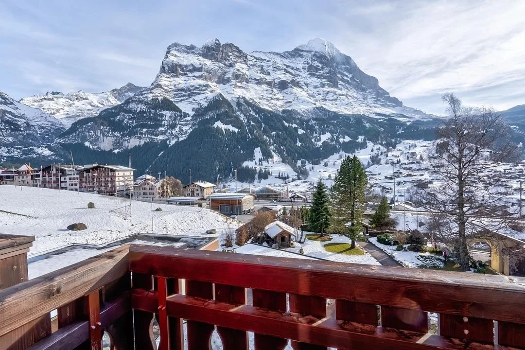 Balcony view of the Eiger Glacier in Switzerland covered in snow.