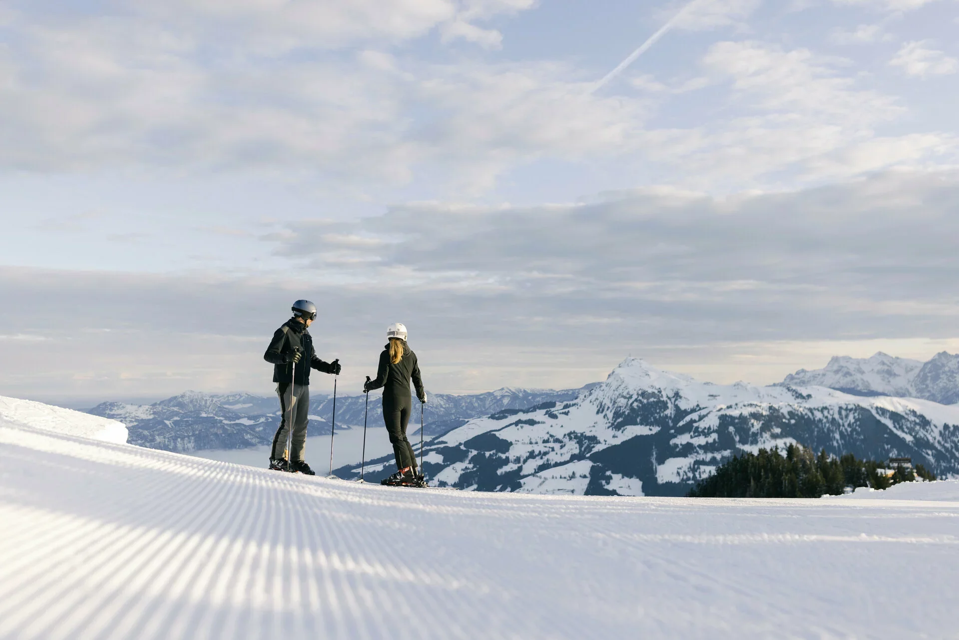 A couple skiing in Kitzbuhel with great conditions