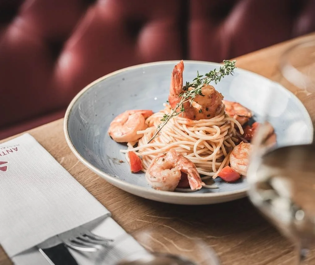 Seafood pasta served fresh with large prawns, fresh herbs and a generous portion of spaghetti.
