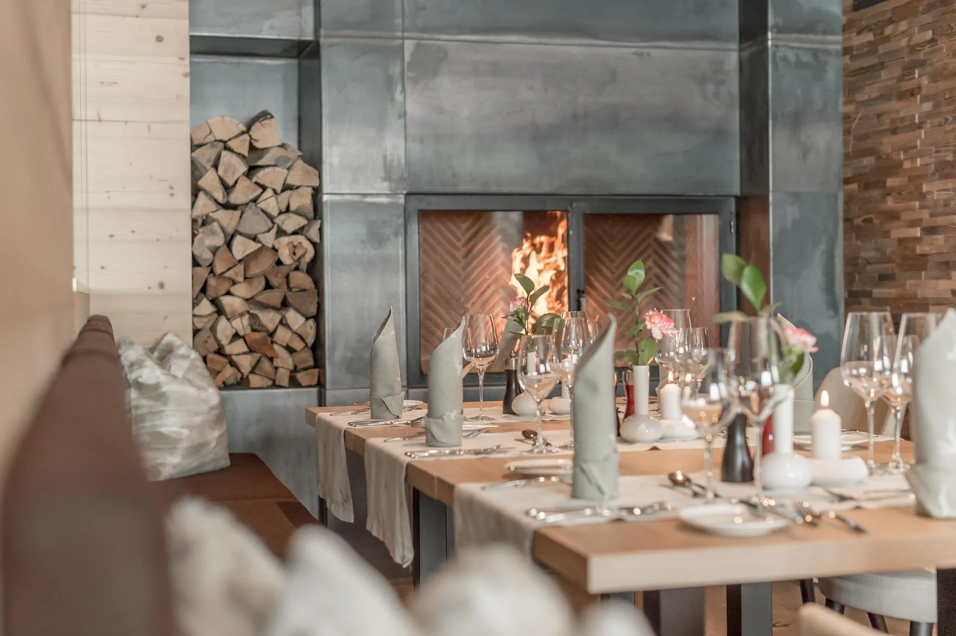 Restaurant setting at the Hotel Gurglhof. Firewood ready to top up the fireplace.