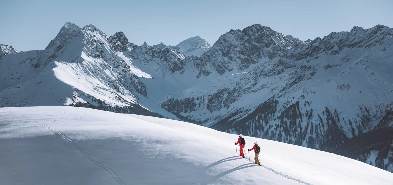 Back country skiing in Fiss with the mountains covered in fresh snowfall.