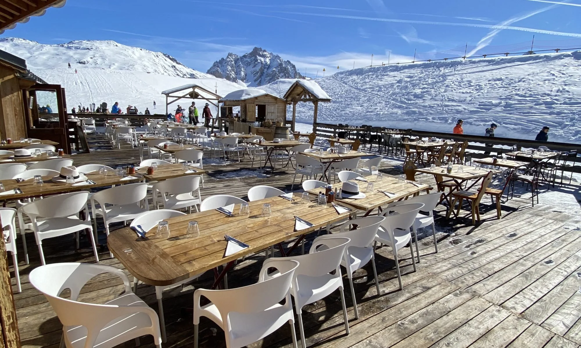 Chalet Tonia, Meribel terrace on sunny day with snow-capped roofs