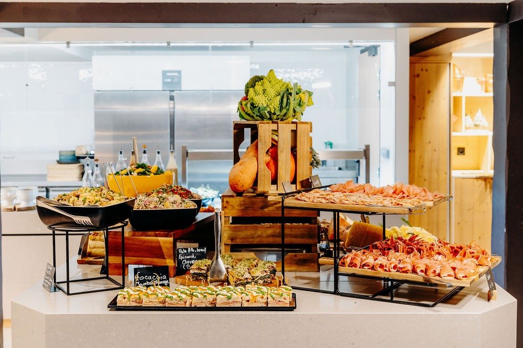 Buffet style food laid out across different levels.