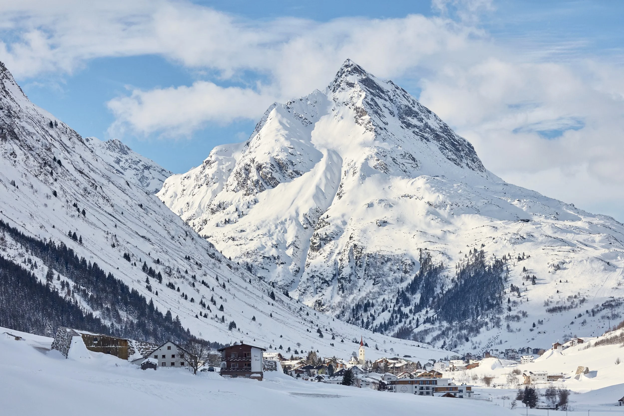 Ischgl village, set at the foot of impressive soaring mountains offering a wide range of high-altitude pistes.