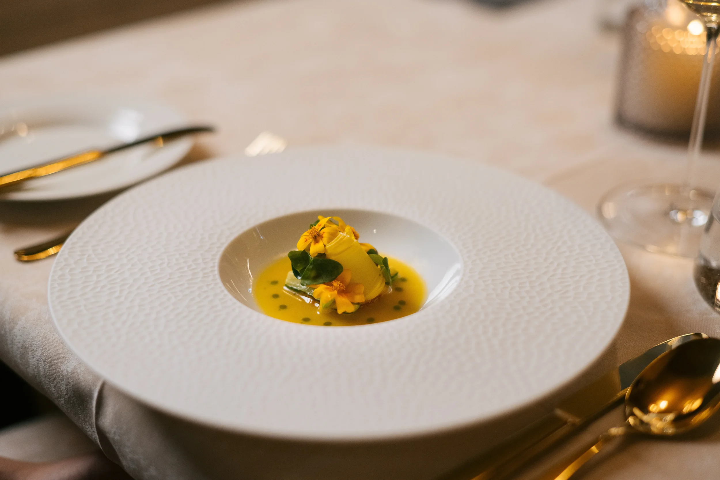 Exceptional detail on this dinner plate, bright oranges, yellows and flowers.
