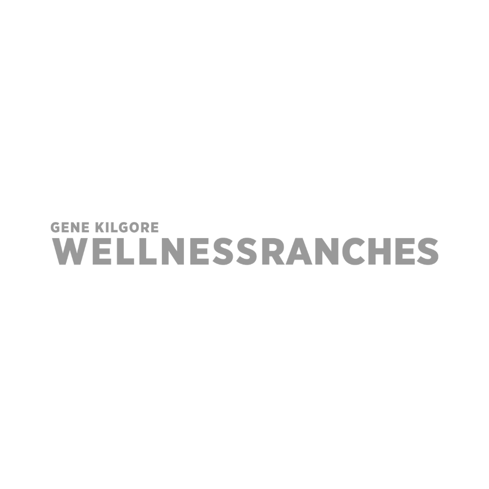 Book cover for 'Wellness Ranches' by Gene Kilgore with a black background and the title in gray, along with a small image of a person's face in the top right corner.