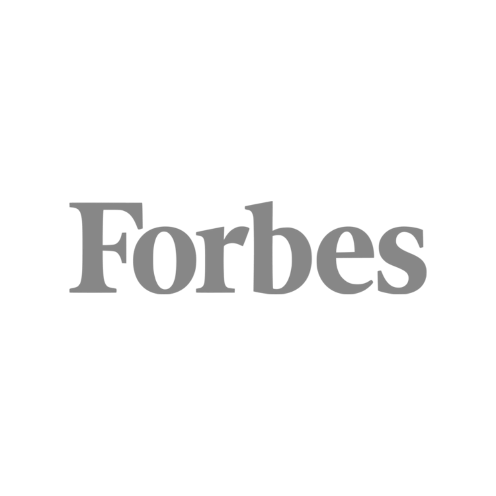 Black background with a large white film camera icon above the gray 'Forbes' logo.
