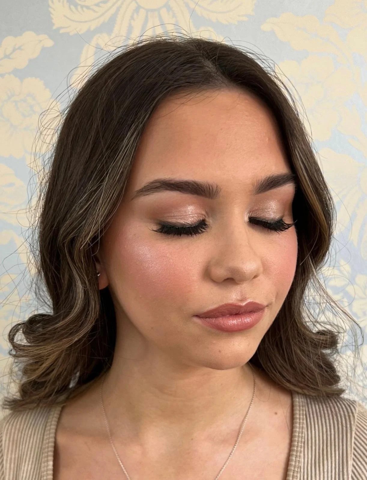 Prom Makeup from Kelly Marie with styled brown hair 