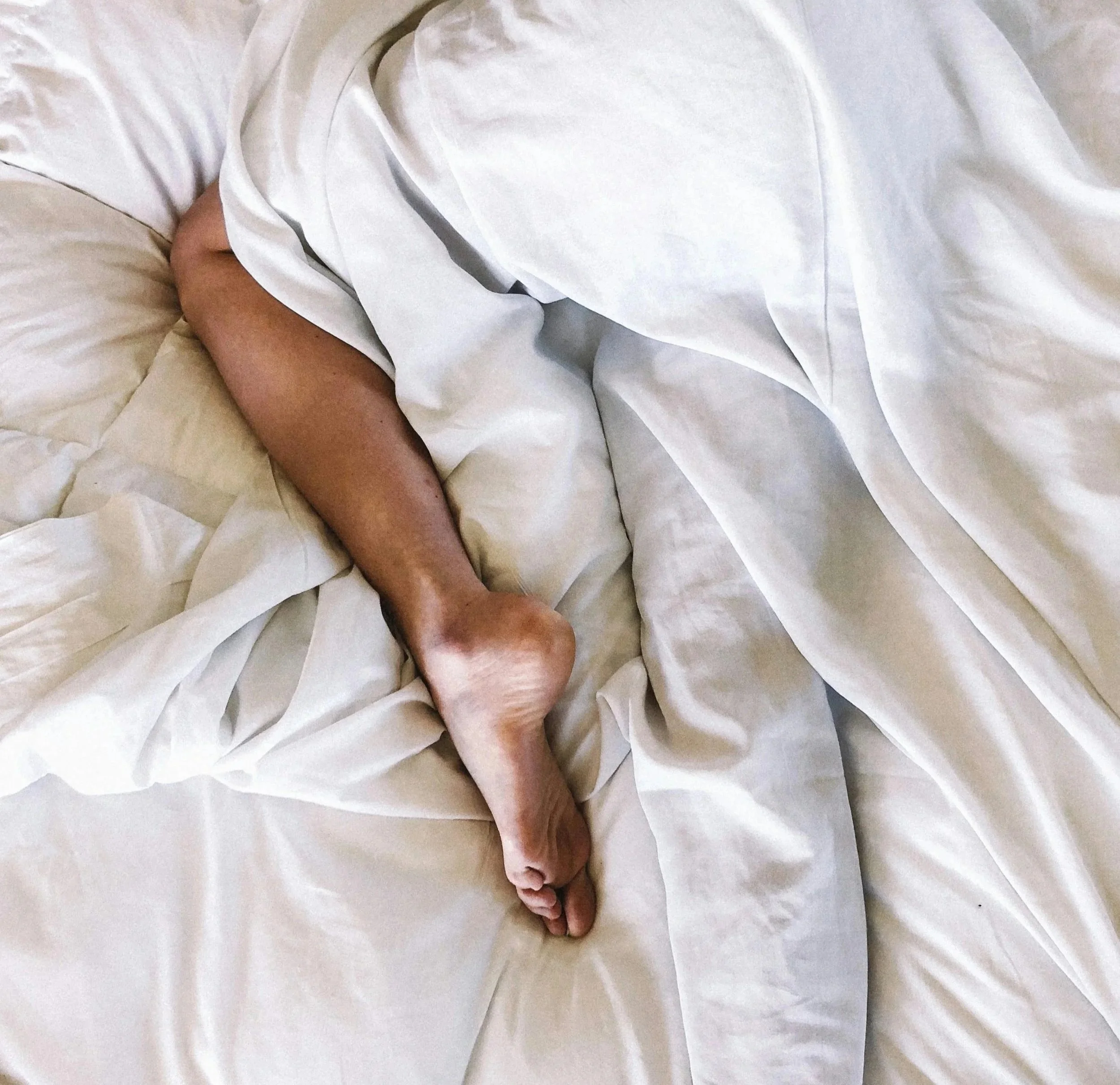 Leg-in-white-sheets