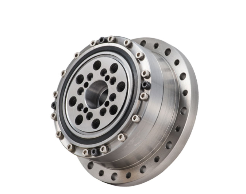 A strain wave gearboxes  made of metal with multiple bolts and circular holes.