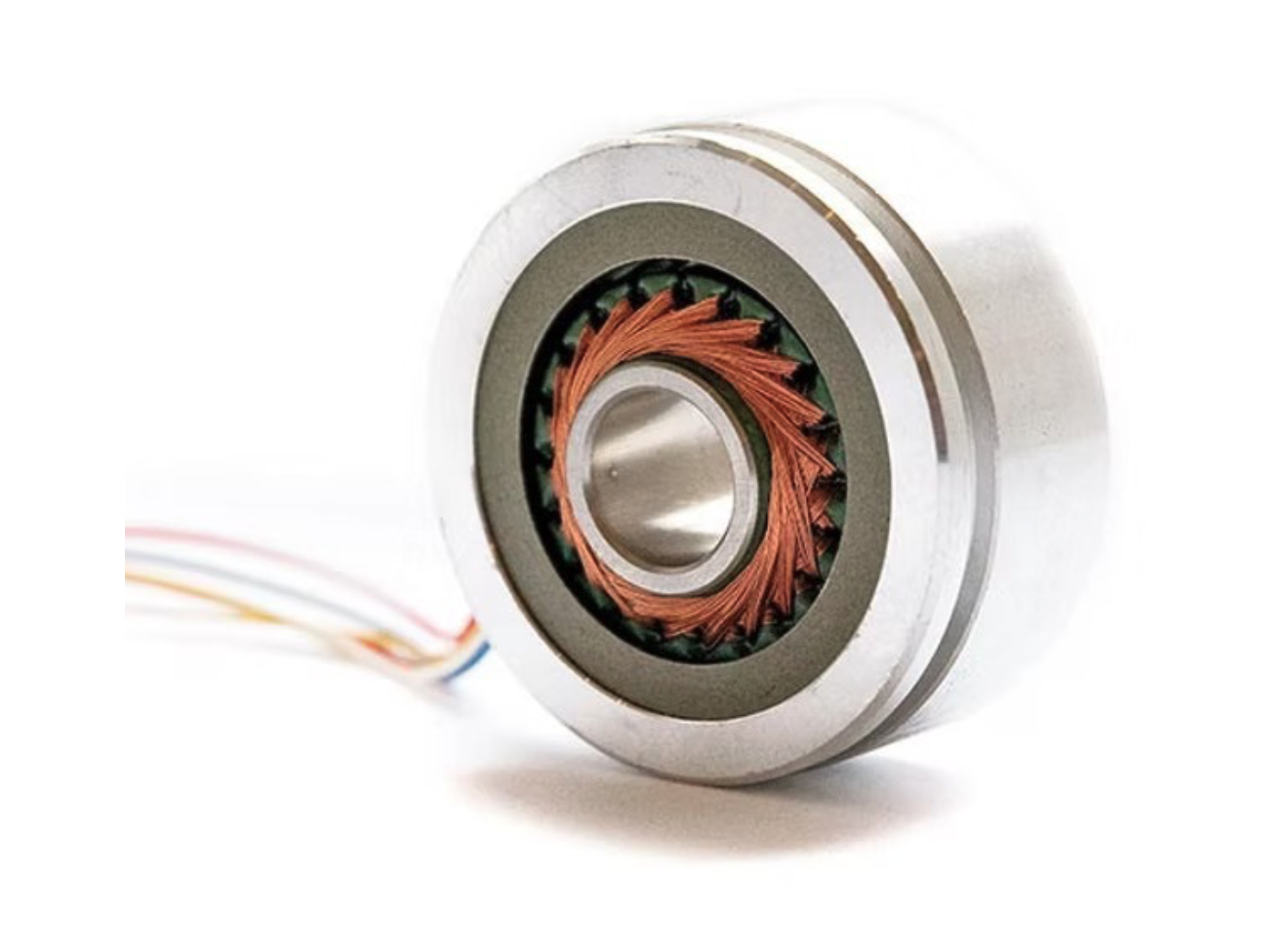 Close-up of a SmartSyn resolver with copper wire windings and a metal shaft.