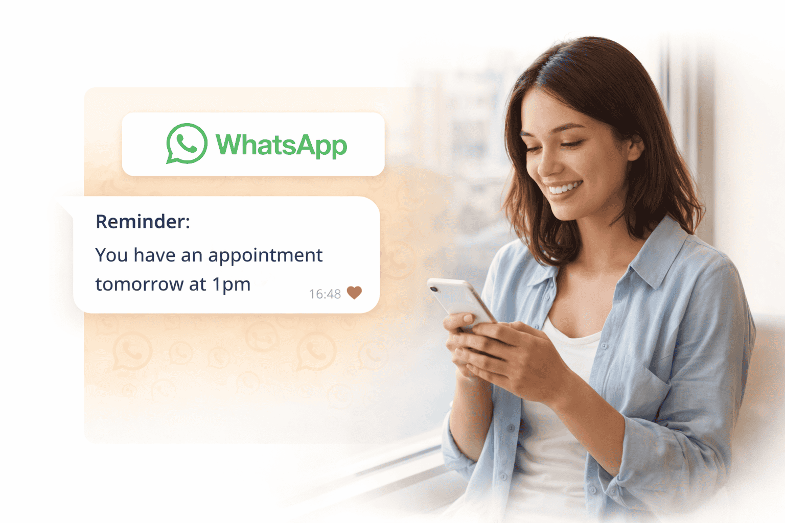 A woman smiling while looking at her phone, with a WhatsApp message notification about an appointment reminder on the screen.
