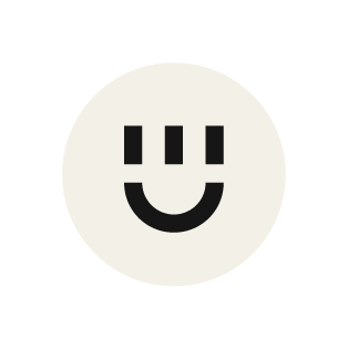 White smiley face with three black dots in the shape of a face