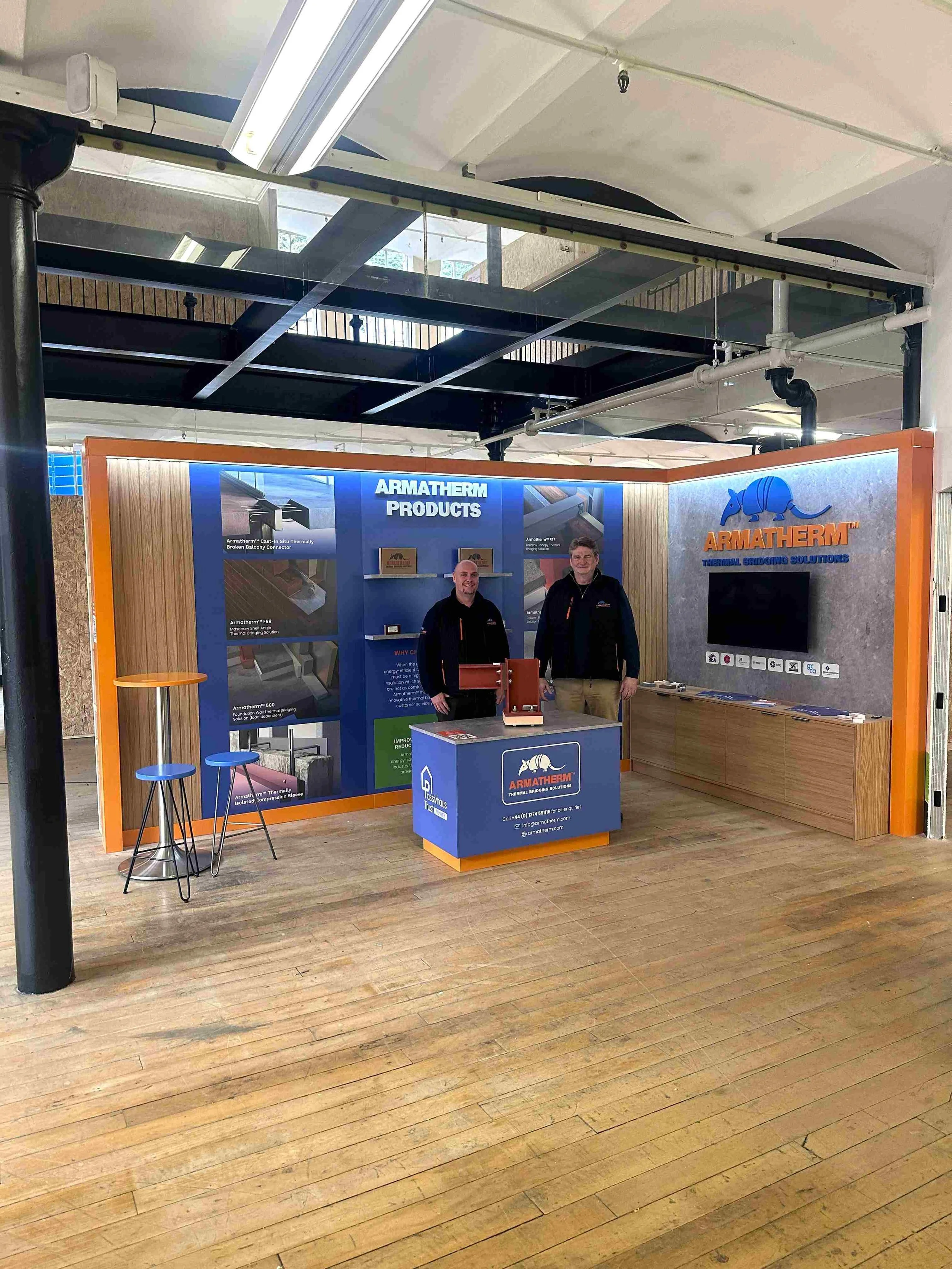 Armatherm permanent exhibition space with product display, branded graphics and presentation counter