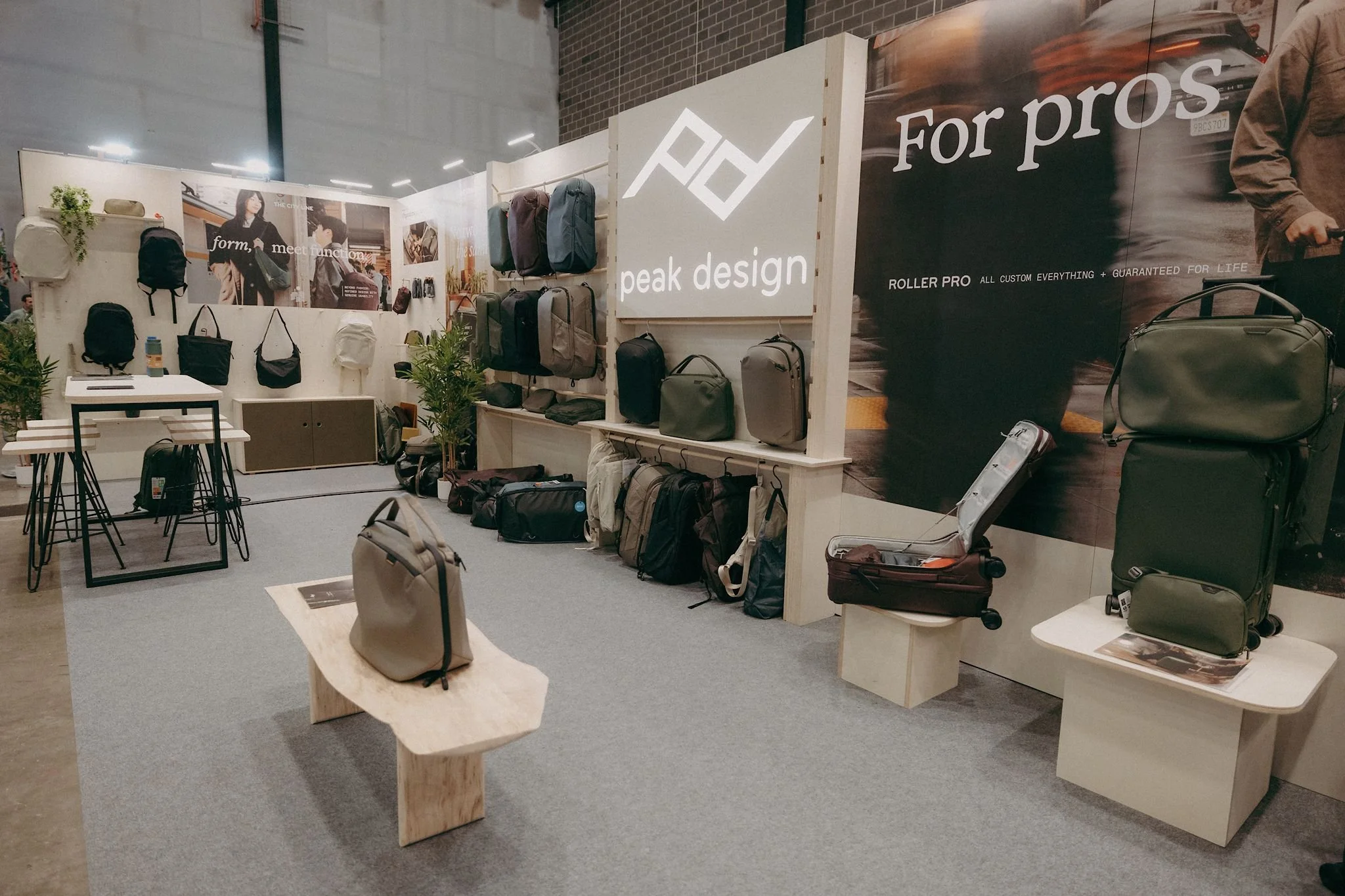 Peak Design backpack and travel bag display within a bespoke modular exhibition stand