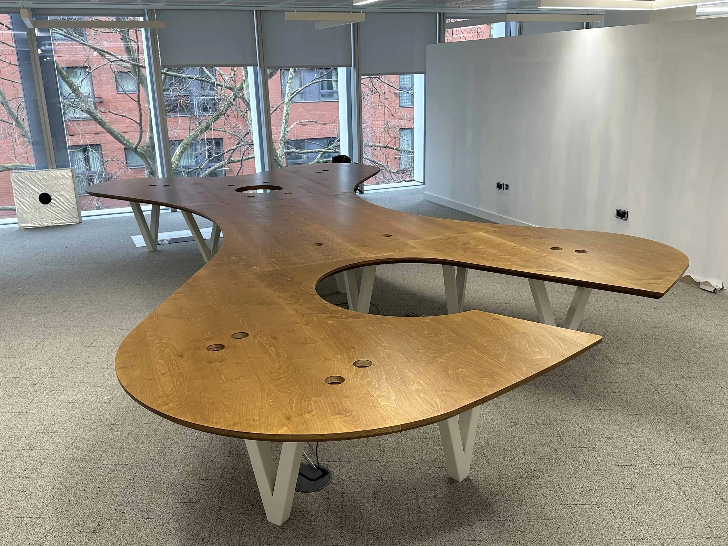 Completed bespoke studio desk installed in a commercial workspace