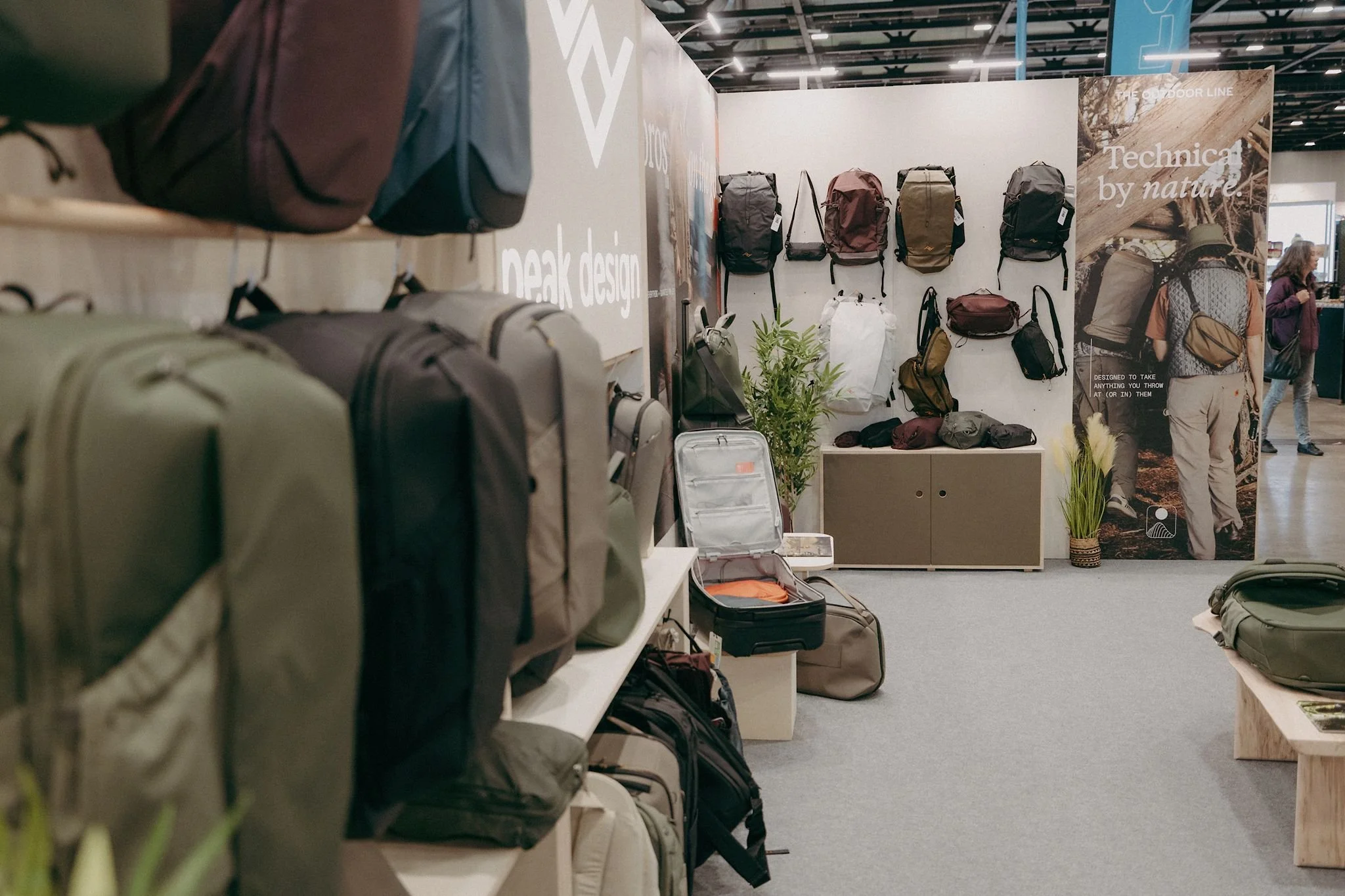 Premium modular exhibition stand for Peak Design showcasing bags, packs and travel products