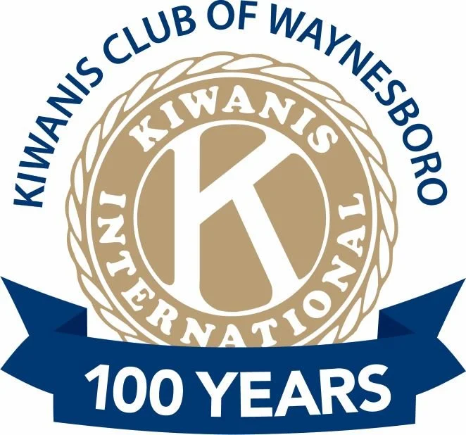 Logo of Kiwanis Club of Waynesboro's 100th anniversary, featuring a large 'K' in the center surrounded by the words 'Kiwanis International' and the club's name, with a blue ribbon at the bottom stating '100 Years'.