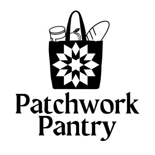 Logo for Patchwork Pantry featuring a black tote bag with a geometric patchwork pattern, containing groceries like a jar, a baguette, and a bottle.