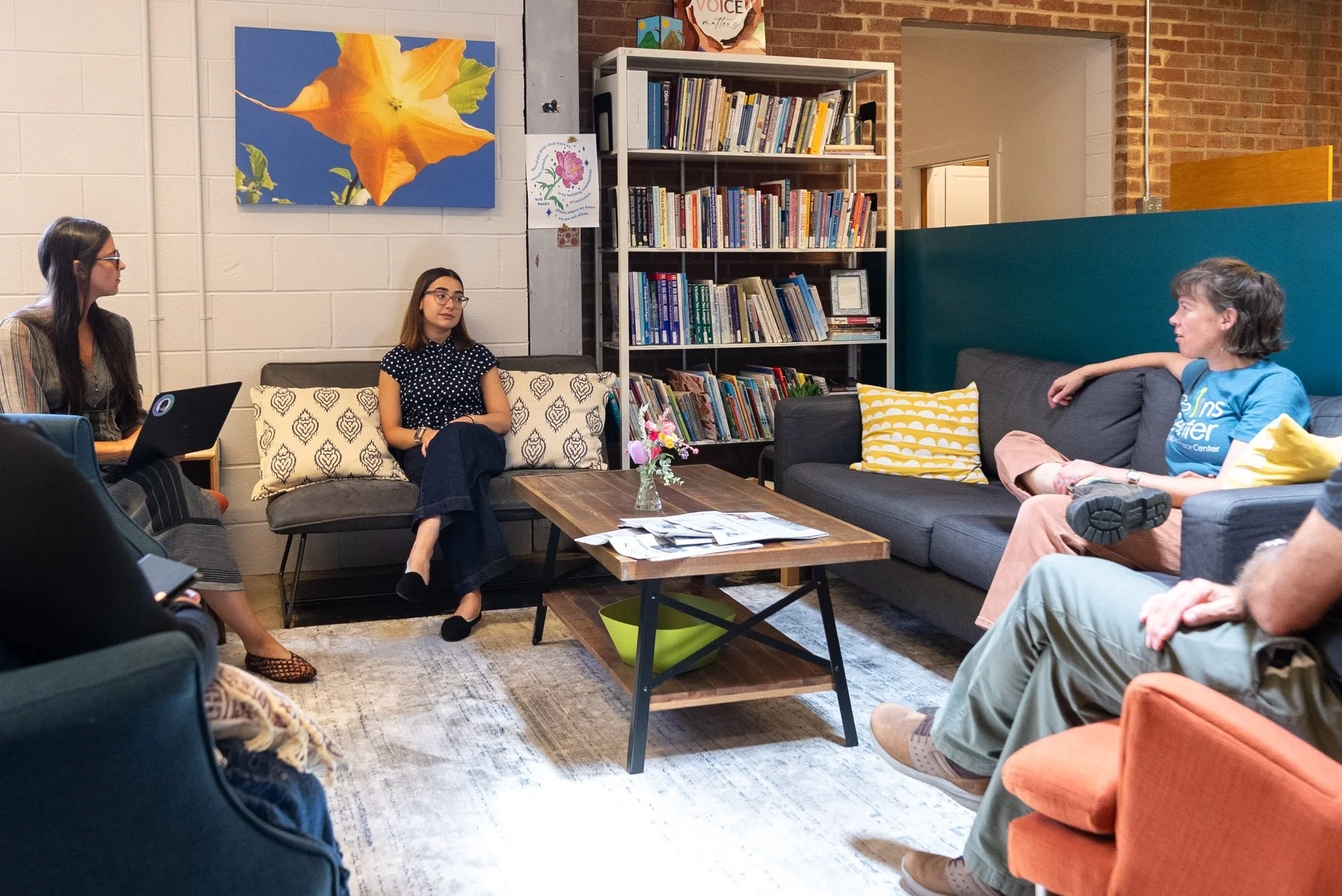 a room with some individuals discussing