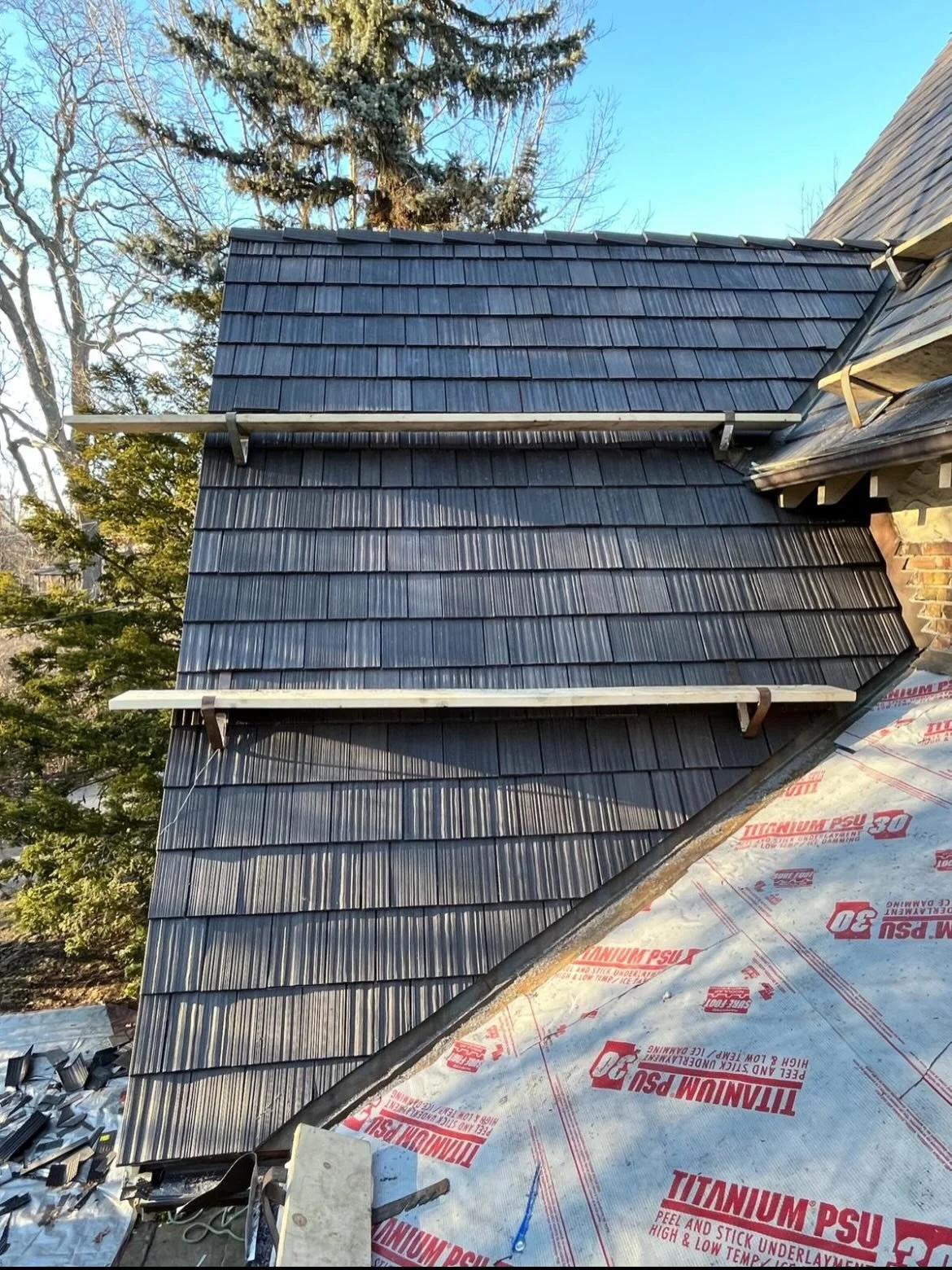 We removed the old leaky cedar roof and installed a brand new DaVinci composite multi width cedar roof system with Titanium PSU30 underlayment! Our clients can sleep well at night knowing they have will recieve a manufacturer limited lifetime warrant