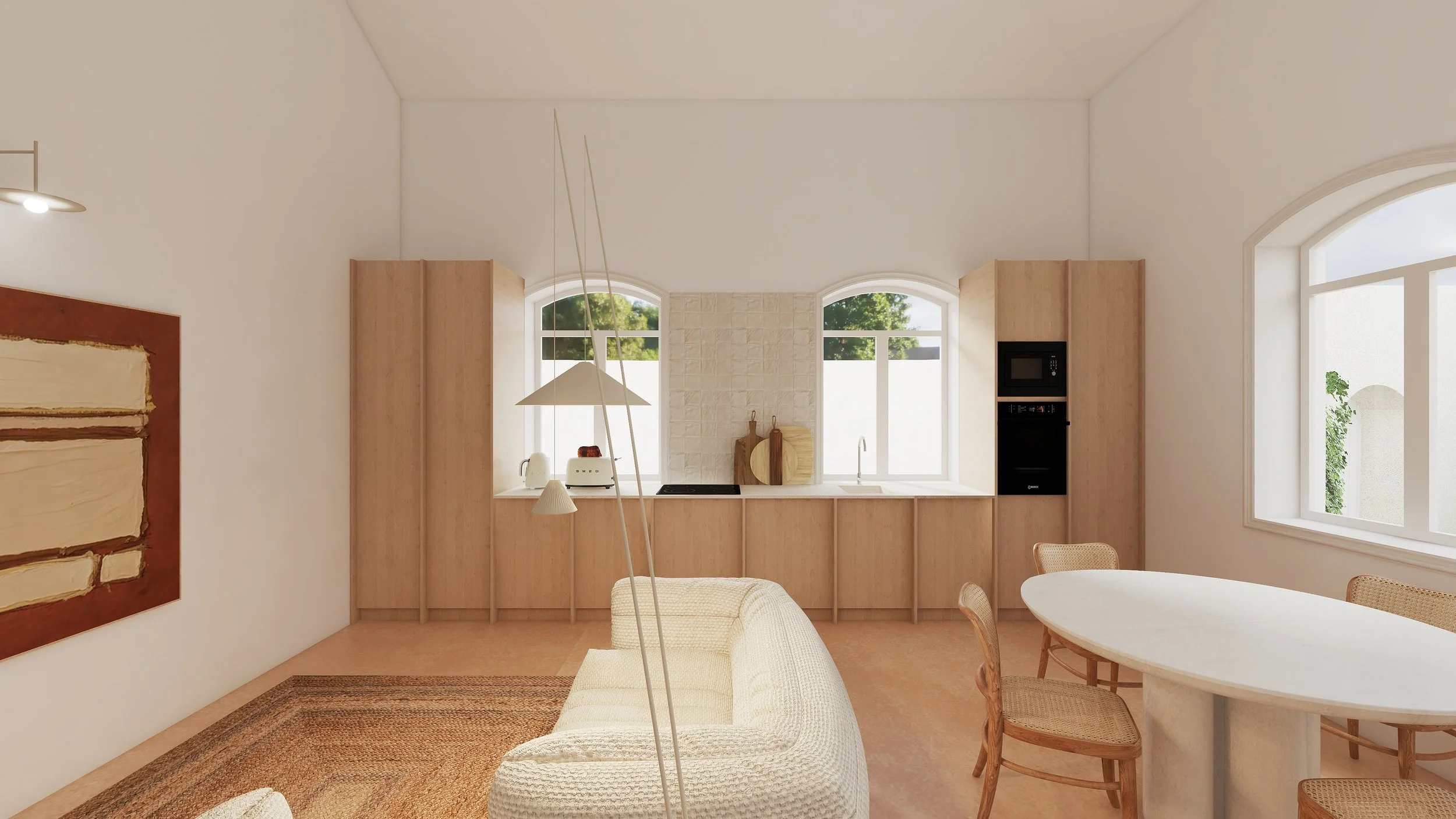 Sala de estar e cozinha com móveis de madeira clara, sofá branco, mesa de jantar oval, cadeiras de madeira, janelas grandes e iluminação natural.